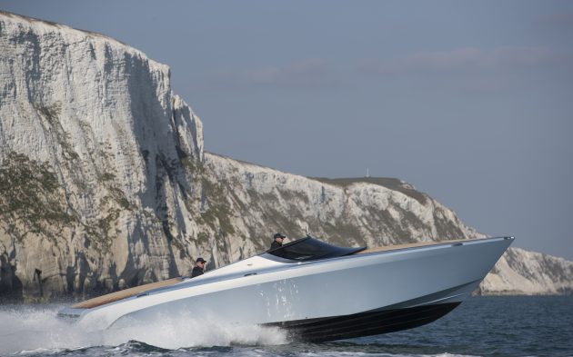 A Aston Martin powerboat being driven off the English coast
