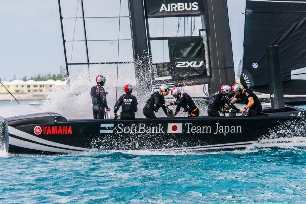 sailors racing a catamaran
