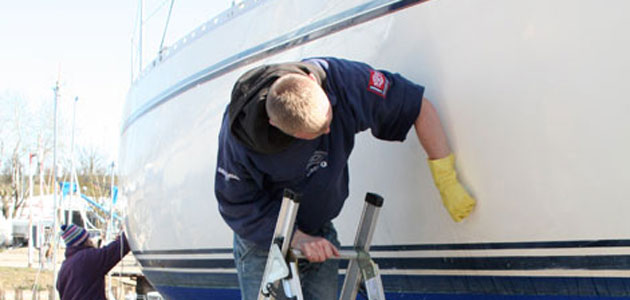 man cleaning boat