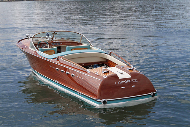 A wooden Riva boat anchored on the water