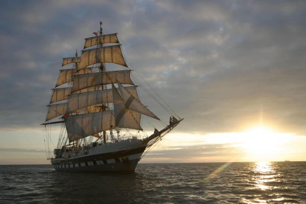 A brig in full sail on the open ocean
