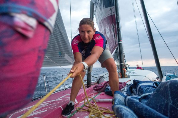 British yachtswoman Dee Caffari unfurling a staysail