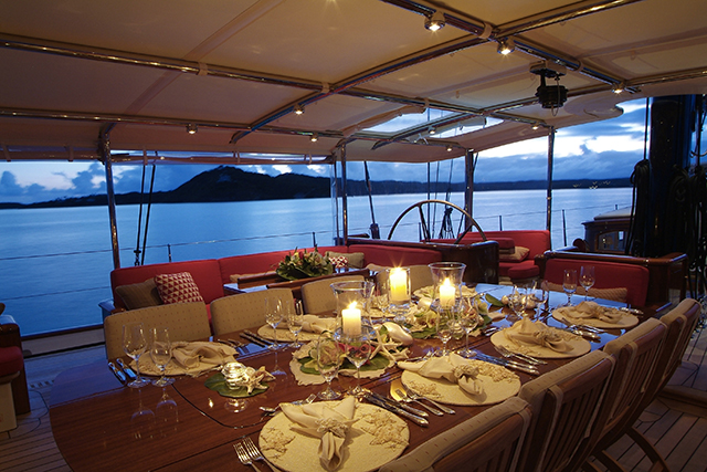 An outside dining area on board a superyacht