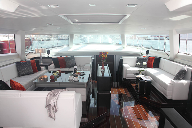 The saloon in white, red and black on board the superyacht Bliss
