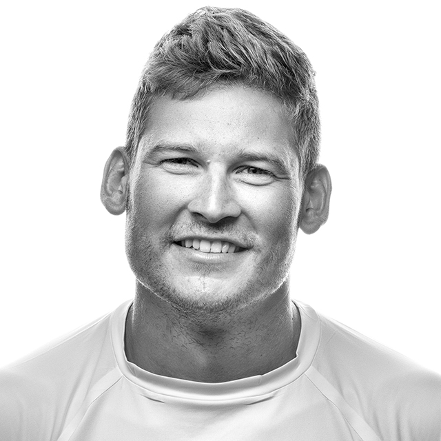 A black and white portrait of a Volvo Ocean sailor