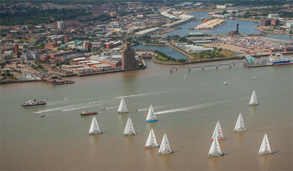 A fleet of yachts on a river in Liverpool
